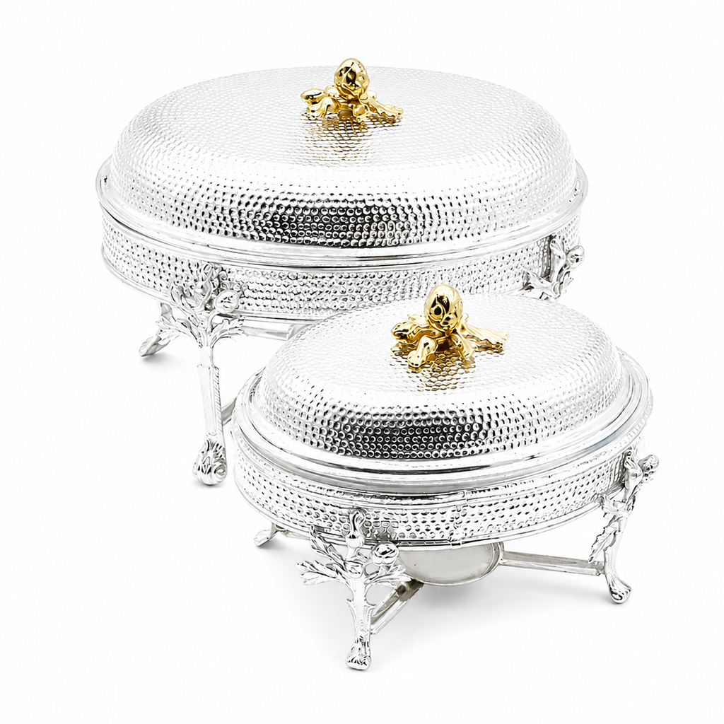 Silver jewelry box with gold accents on a white background