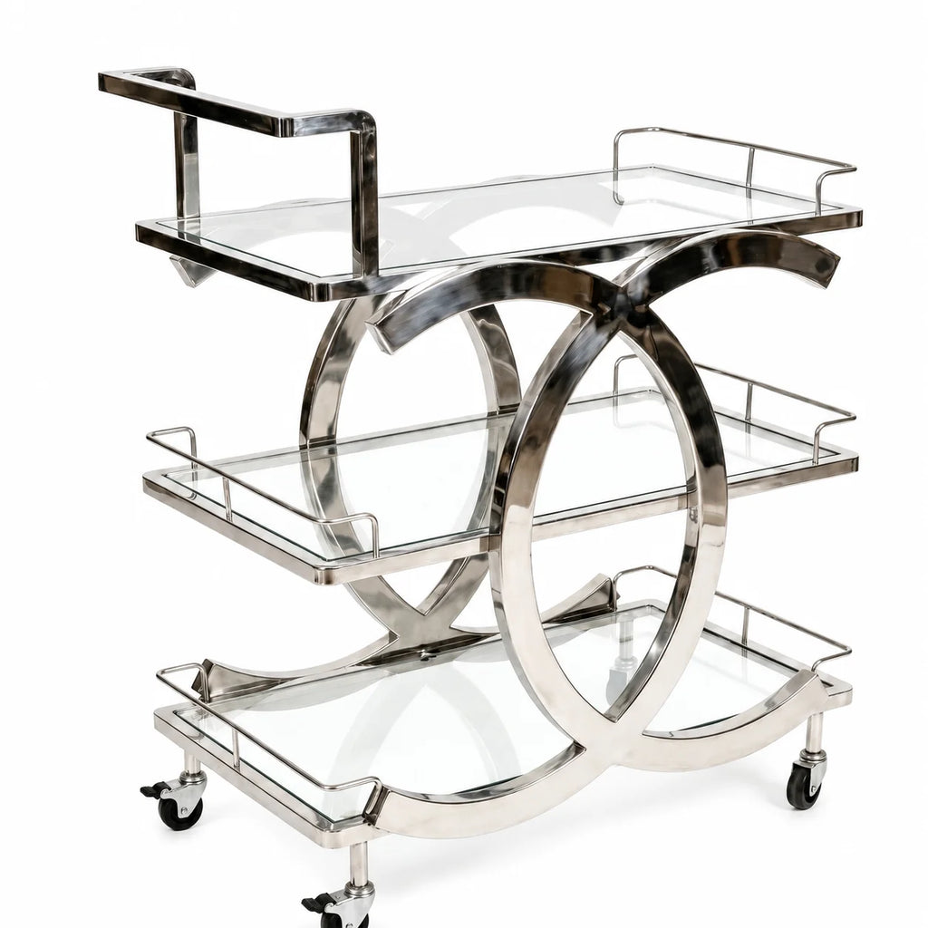 Chrome bar cart with glass shelves on a white background