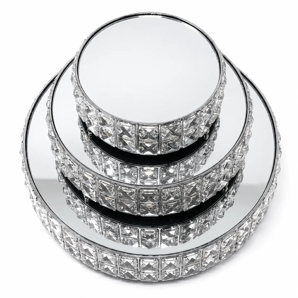 Stack of crystal cake stands on a white background