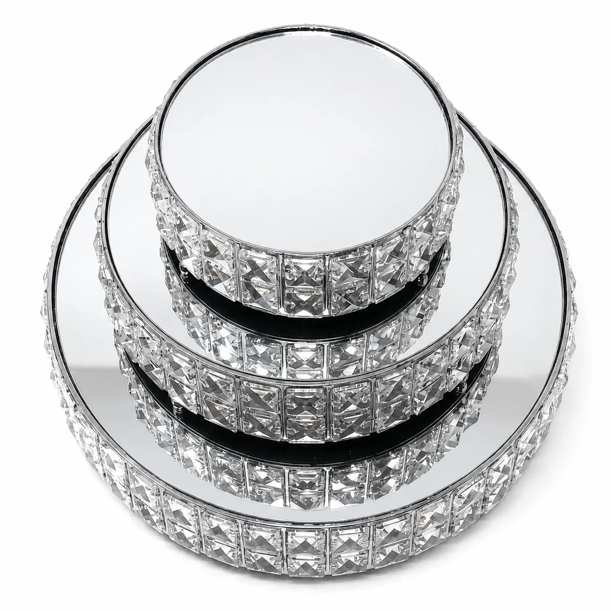 Stack of crystal cake stands on a white background