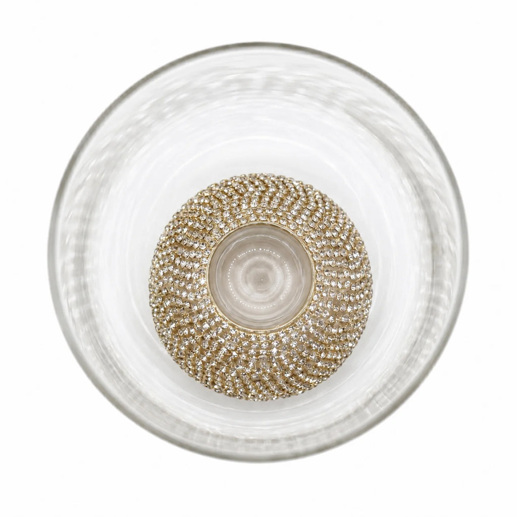 Decorative glass bowl with a textured design on a white background