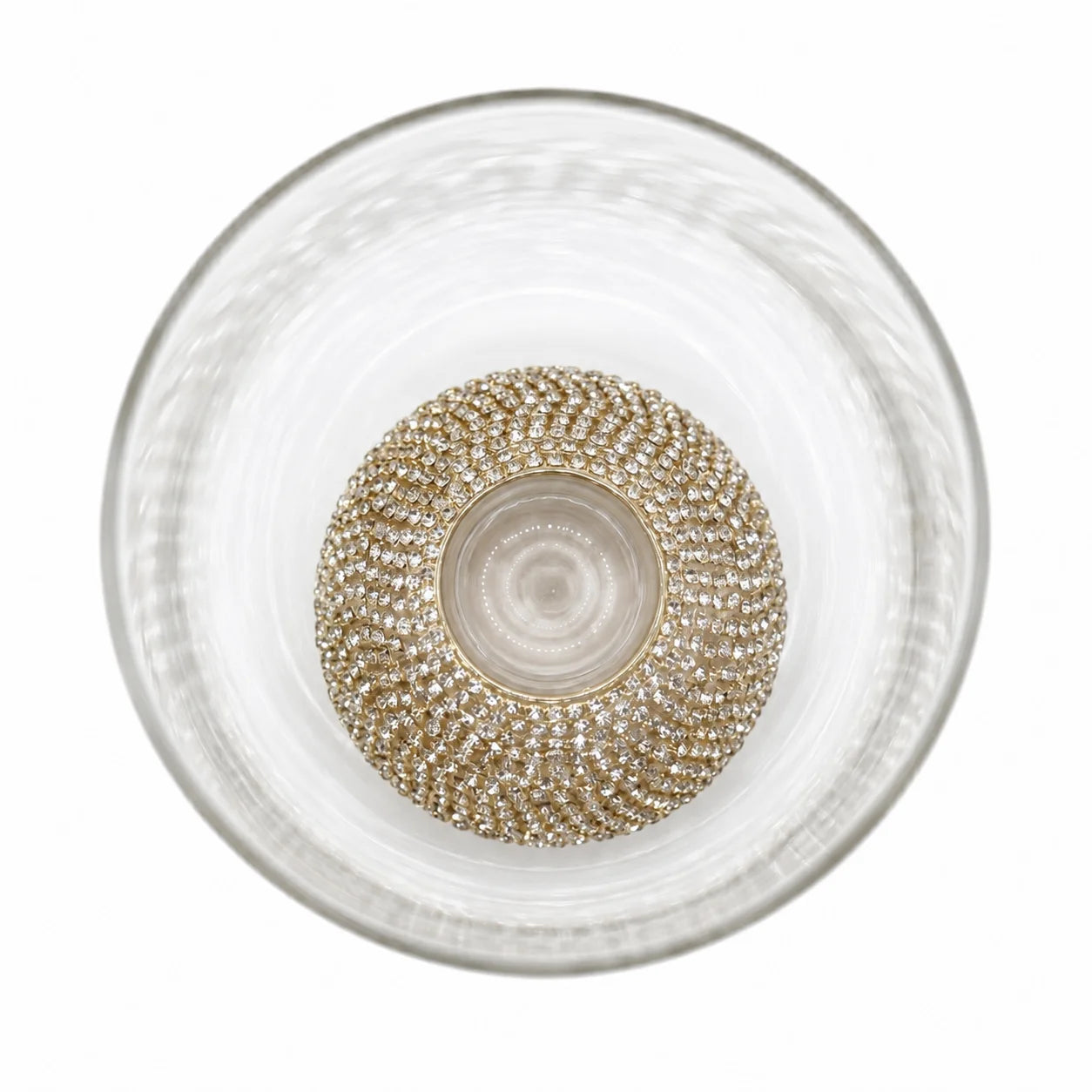Decorative glass bowl with a textured design on a white background
