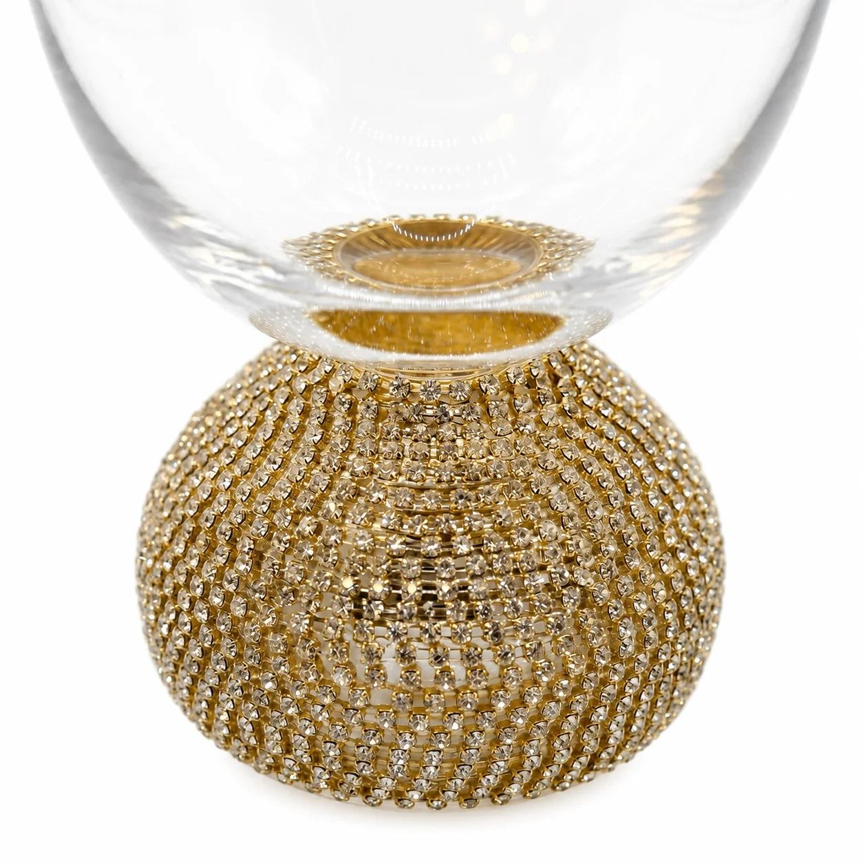 Decorative glass item with gold beaded base on a white background