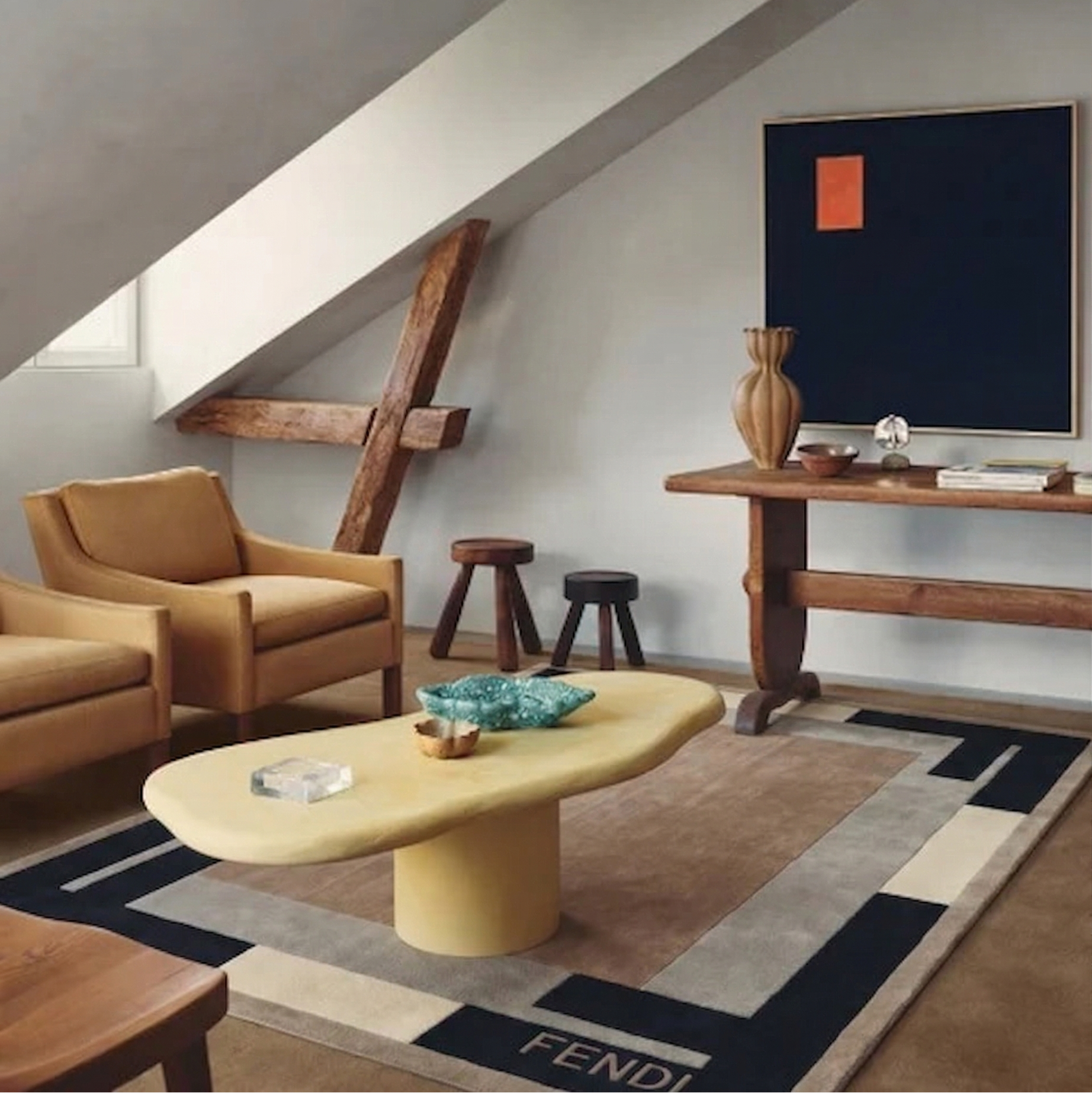 Modern living room with brown armchair, yellow coffee table, and Fendi rug.