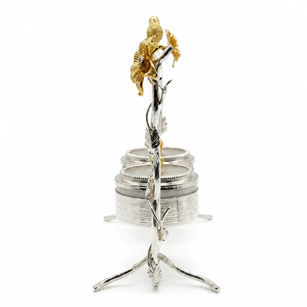 Decorative silver and gold flower sculpture on a white background