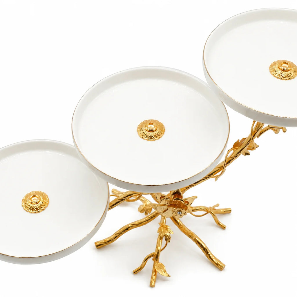 Set of white dishes with gold accents on a white background