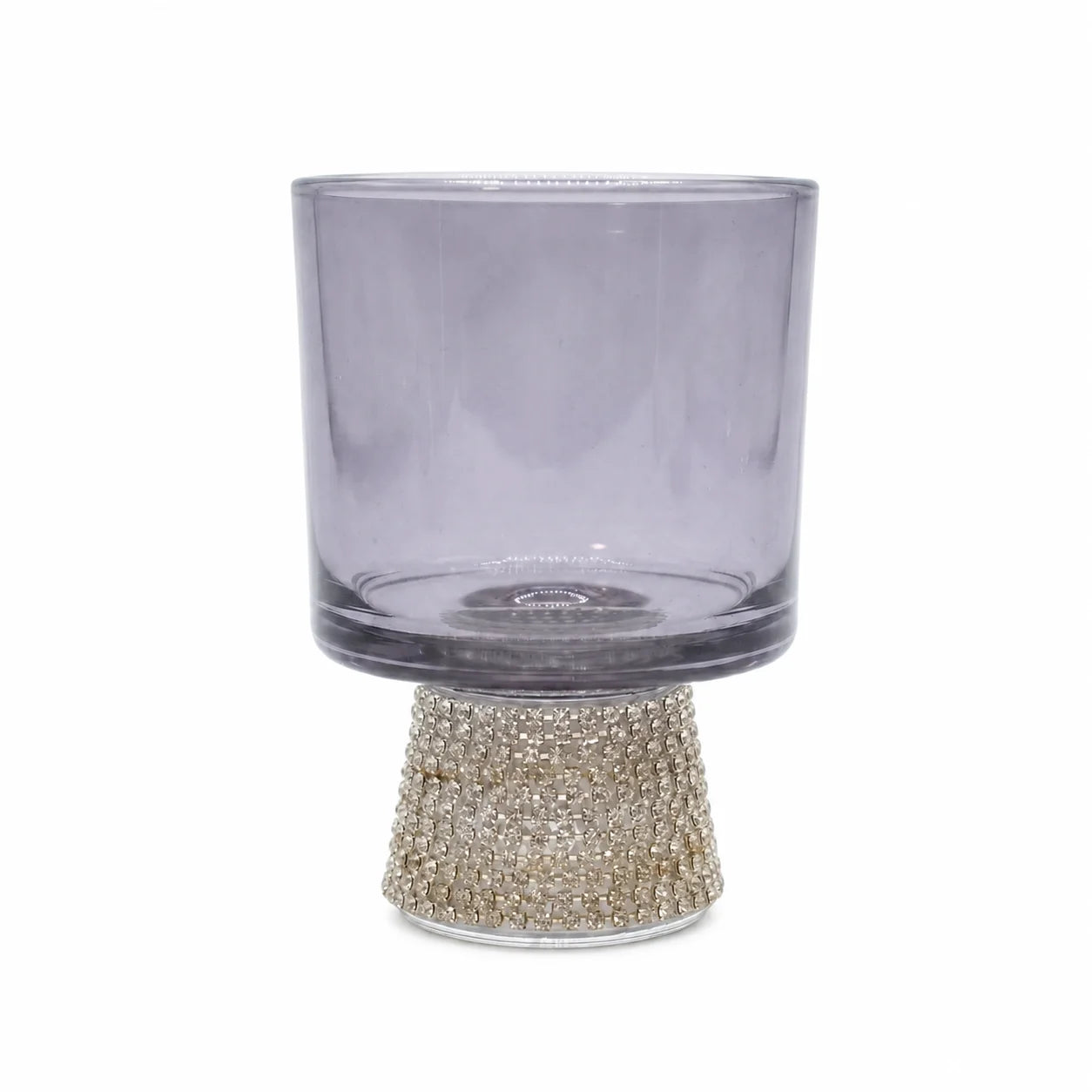 Clear glass candle holder with a decorative base on a white background