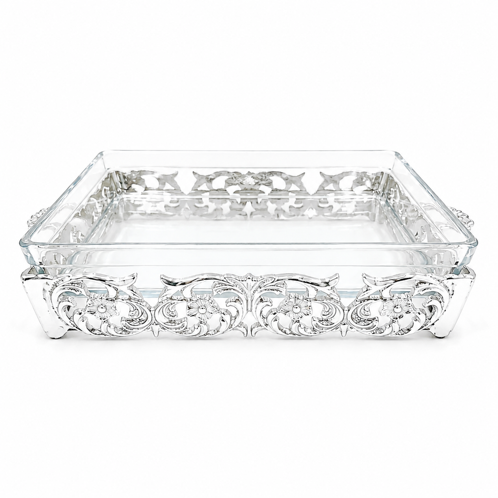Decorative glass tray with intricate metalwork on a white background