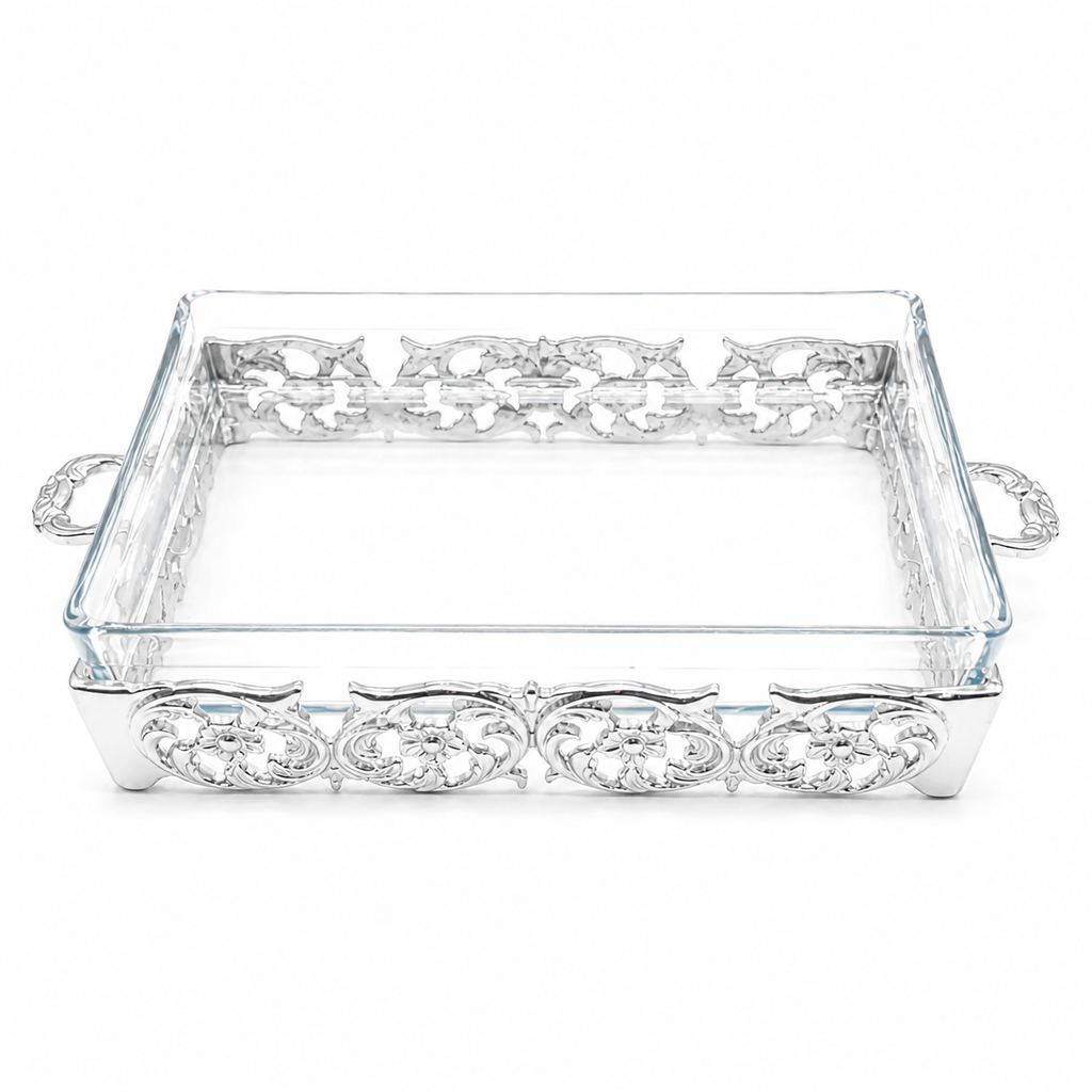Decorative glass tray with silver embellishments on a white background