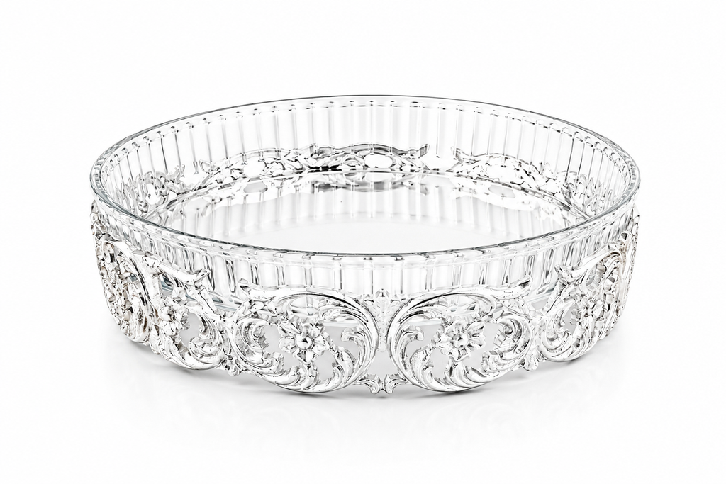 Decorative glass bowl with intricate patterns on a white background