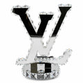 Decorative letter 'V' with crystals on a white background
