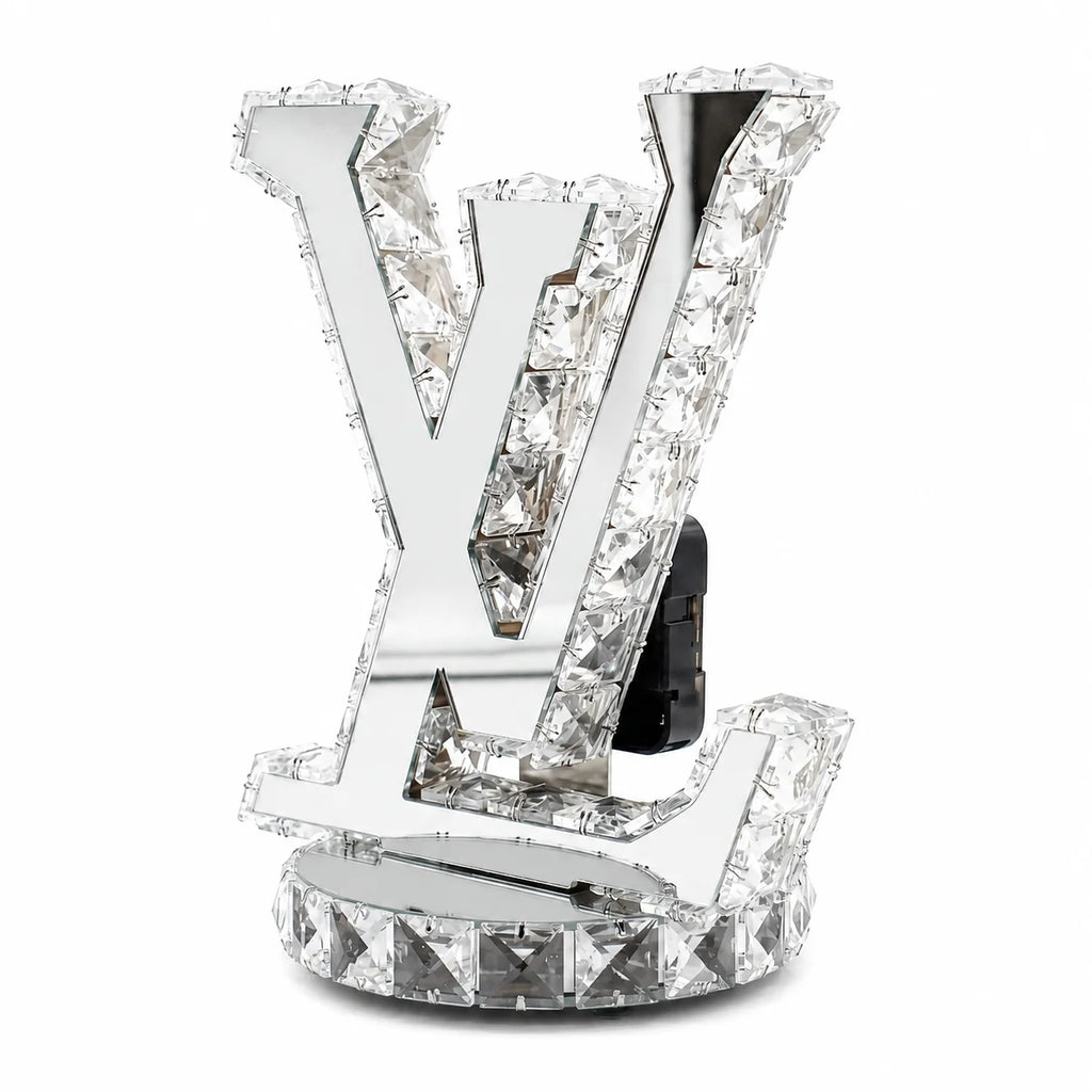 Crystal decorative item with a prominent 'V' design on a white background