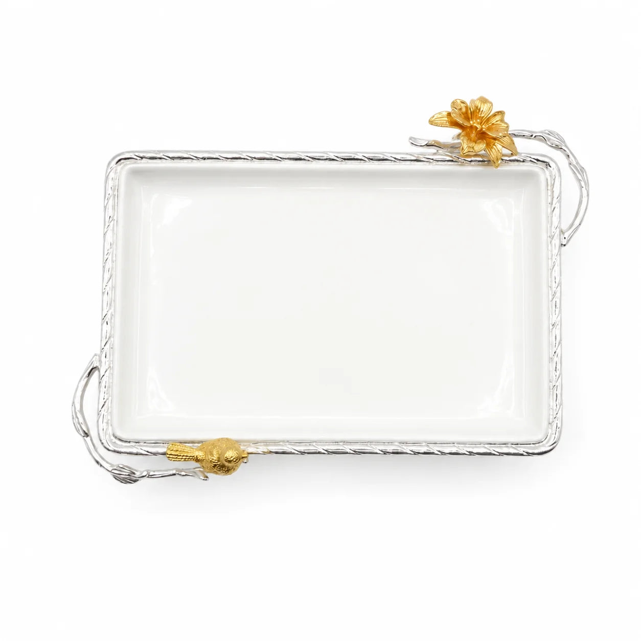 A rectangular white ceramic serving tray with a twisted silver-tone metal border and decorative gold-tone floral accents on the corners, shown on a plain white background.