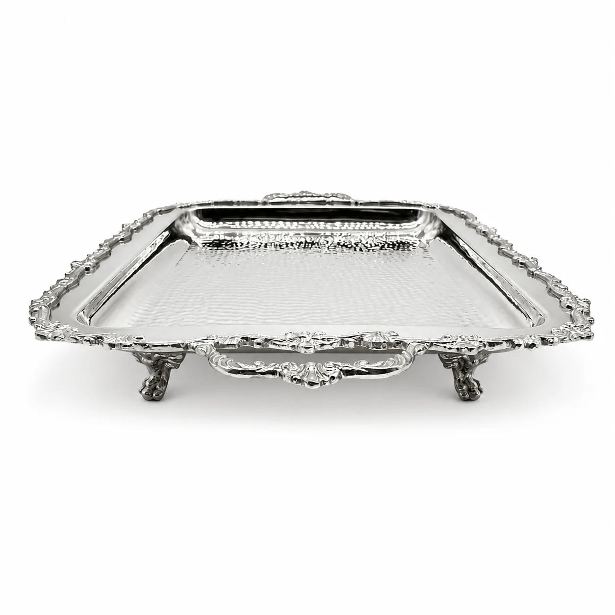 A rectangular silver serving tray with ornate claw feet, a hammered texture, and a decorative handle, shown on a plain white background.