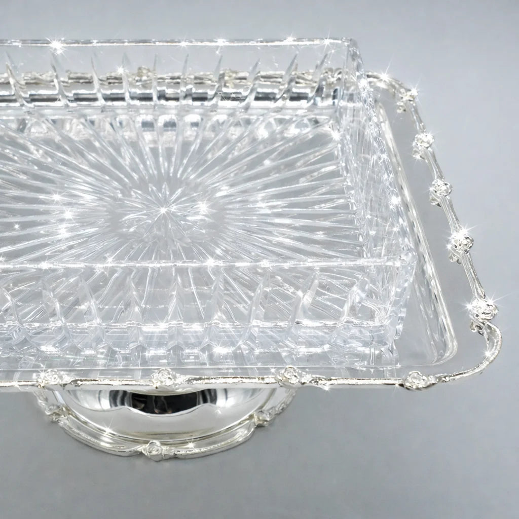 Clear crystal cake stand on a gray background