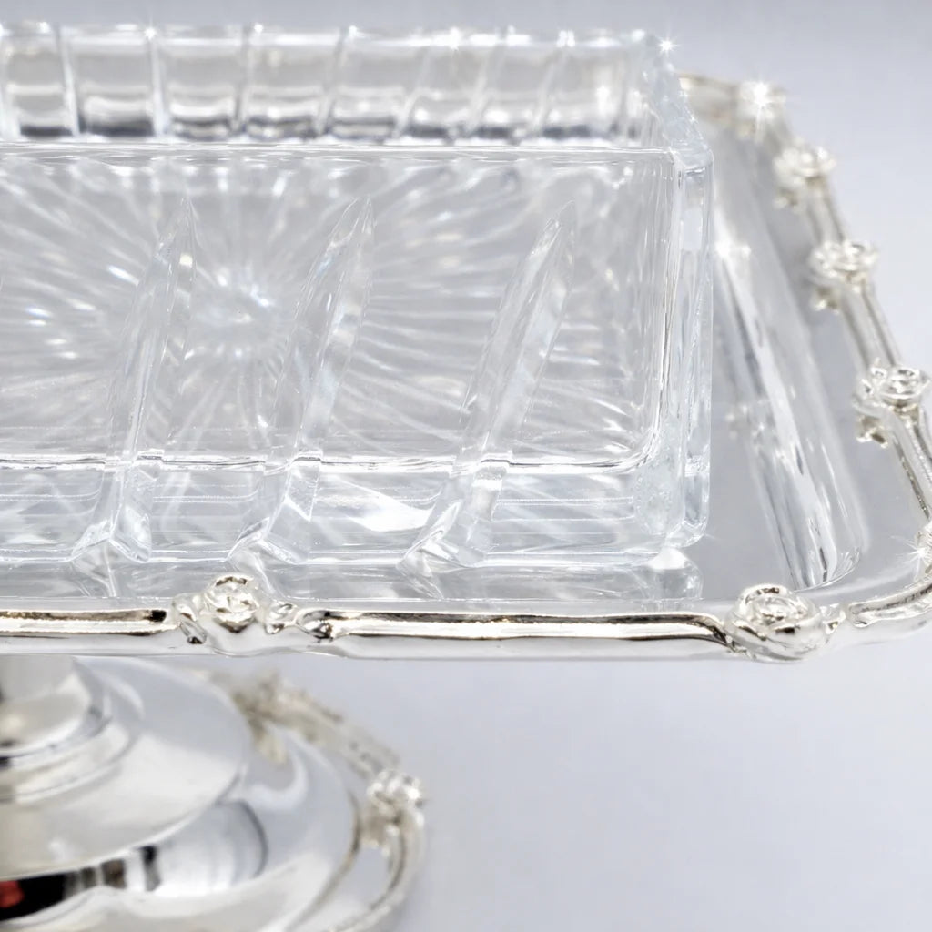 Clear plastic food containers with silver lids on a light gray background
