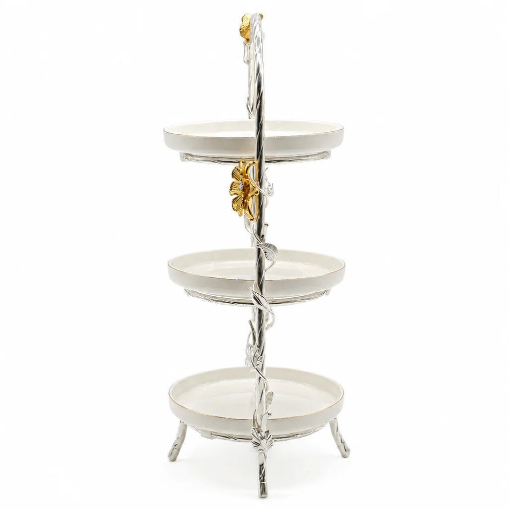Three-tiered decorative stand with a floral design on a white background