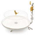 Decorative candle holder with gold and silver accents on a white background