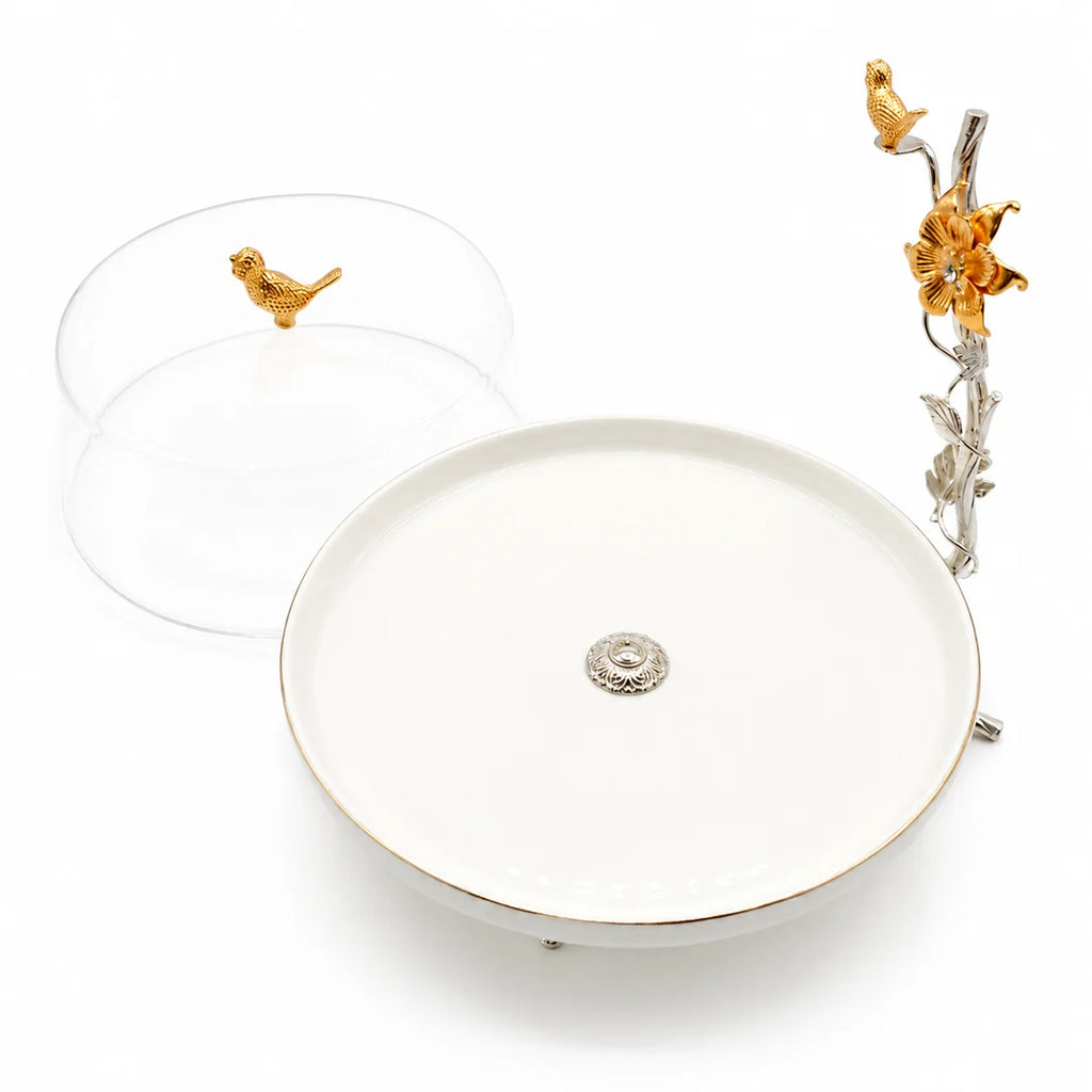 Decorative plate with gold bird and flower design on a white background