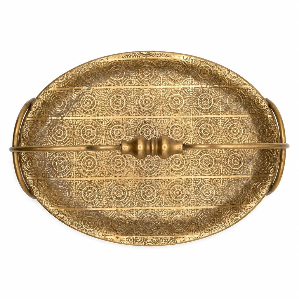 Decorative gold tray with intricate patterns on a white background